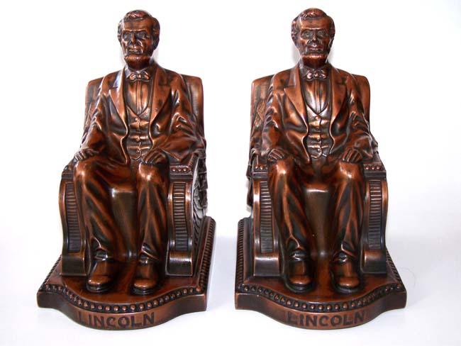 A Beautiful pair of Antique Bookends circa 1924 depicting Lincoln sitting in the chair.